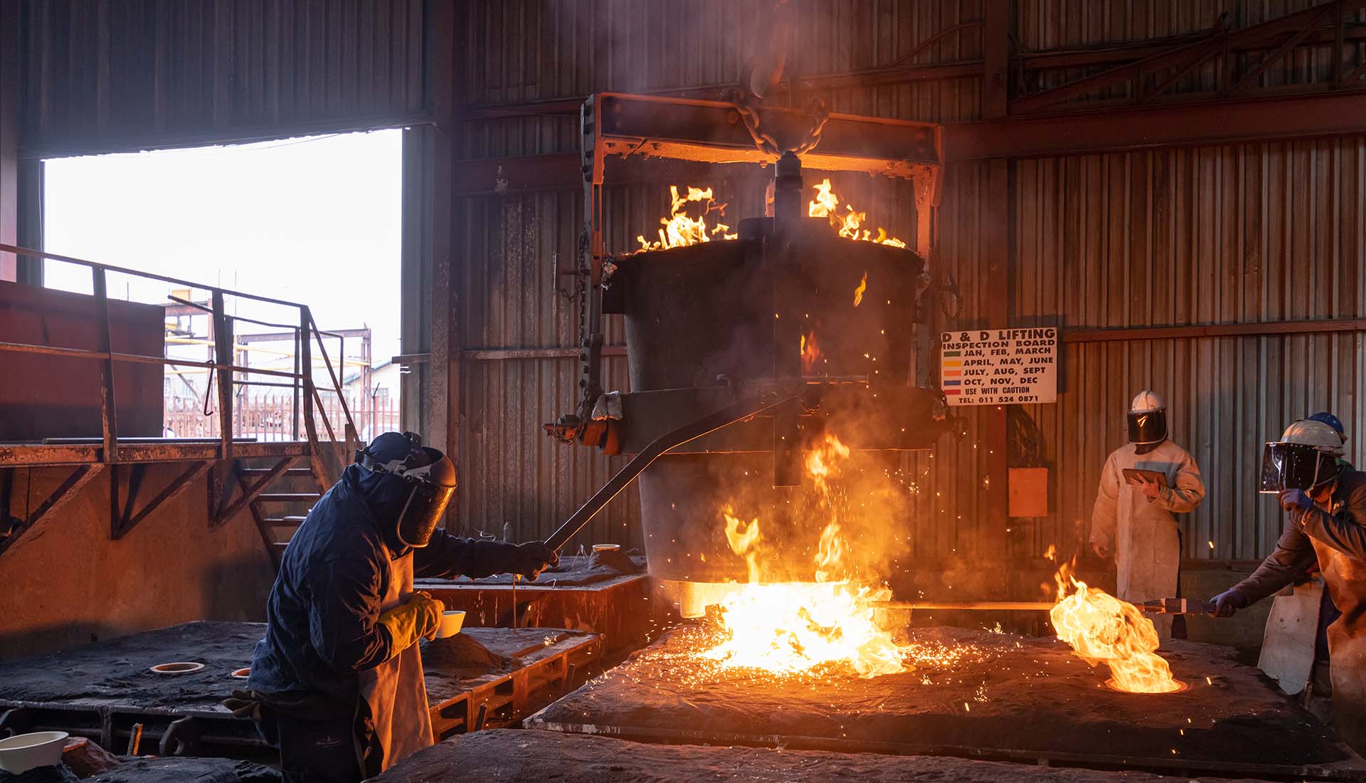 Industrial Photography, Man working in foundry. Prima Foundry